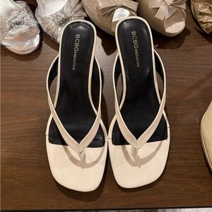 BCBGeneration Women’s White and Black Slide Sandals